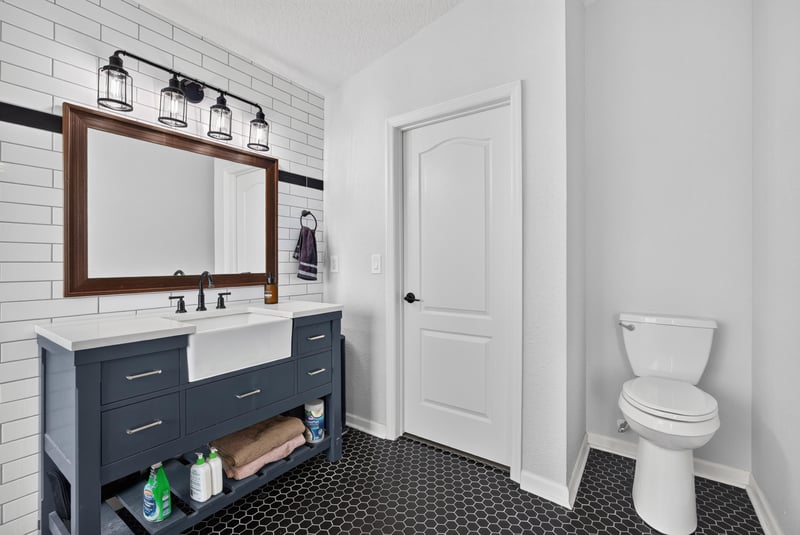 Primary bathroom with dual vanity and framed mirror at 2065 Creekmont Dr