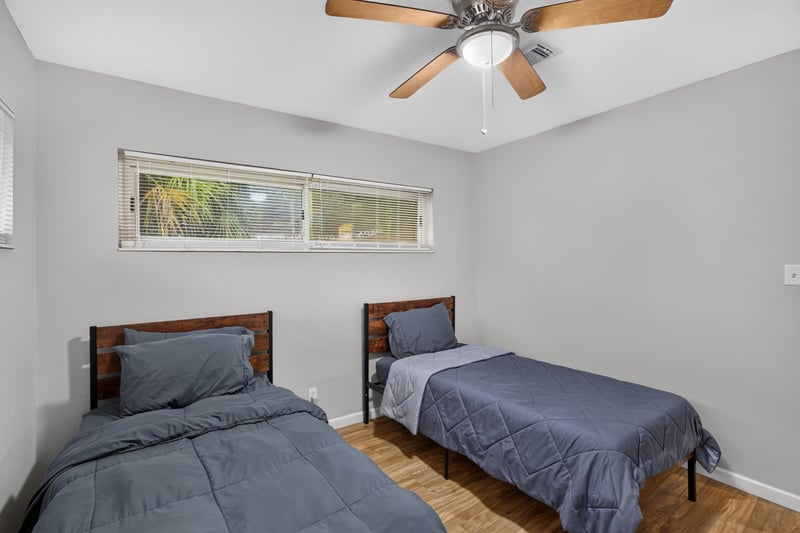 Bedroom with twin bed and window at 9506 Harriet Ave, Jacksonville, FL 32208