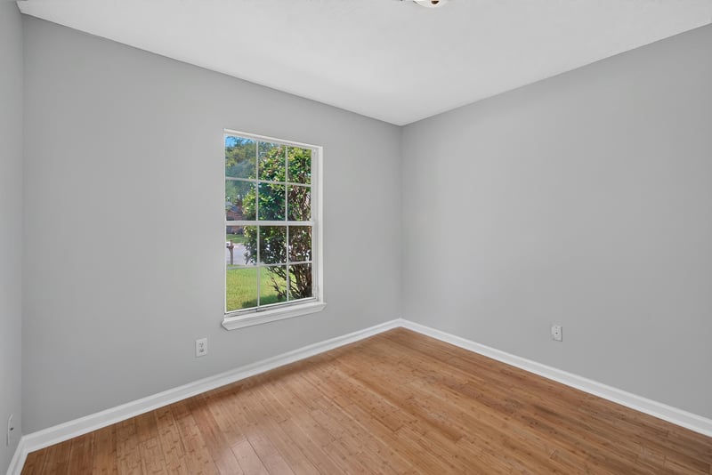 Bedroom with windows and wood flooring at 456 Bay Point Way N, Jacksonville, FL 32259