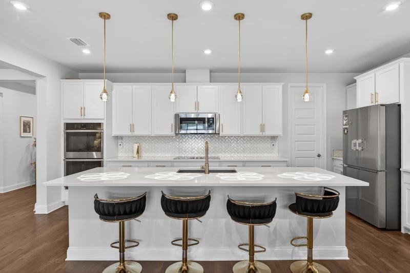 Kitchen island and double wall ovens at 85491 Fall River Pkwy, Fernandina Beach, FL 32034