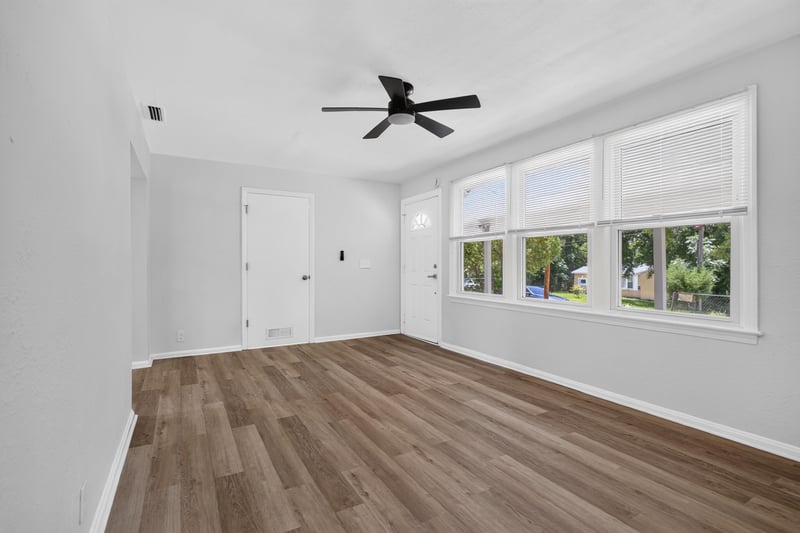 Living and dining area with large windows at 855 Cornwallis Dr, Jacksonville, FL