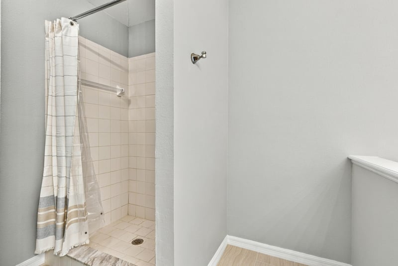 Bathroom shower with tile surround at 11197 Illford Dr