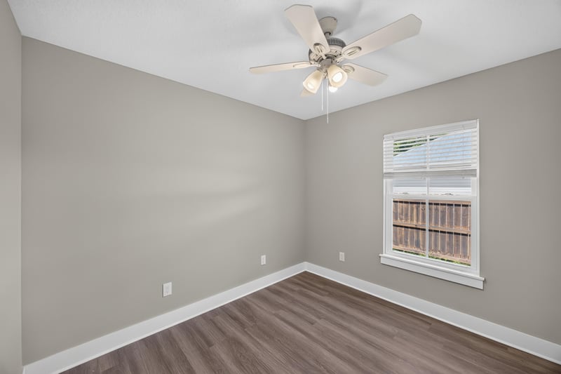 Empty bedroom with window and wood flooring at 2855 N 8th St, St. Augustine, FL 32084