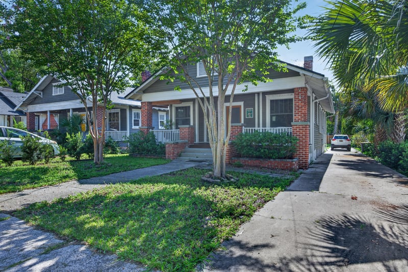 Front exterior angle showing walkway and landscaping at 1555 Belmonte Ave, Jacksonville, FL 32207