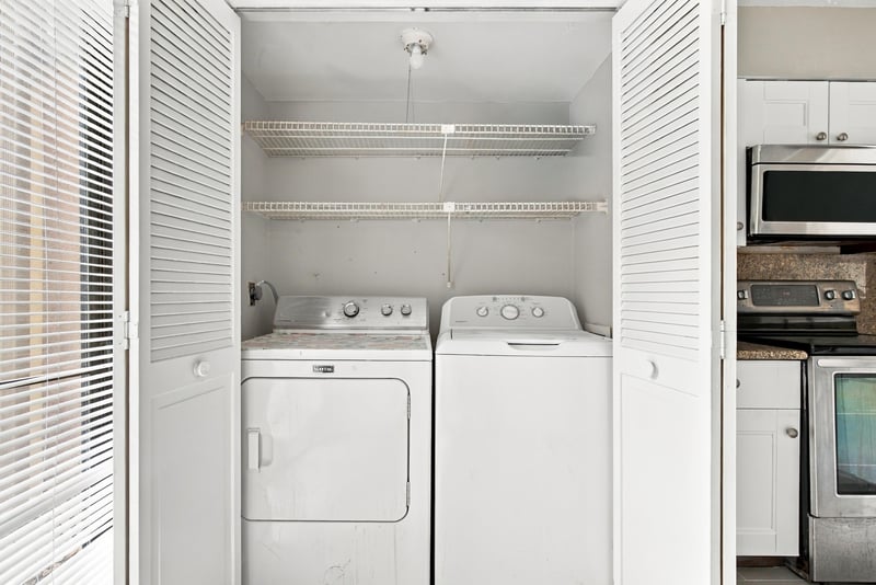 Laundry closet with washer and dryer at 7703 Las Palmas Way