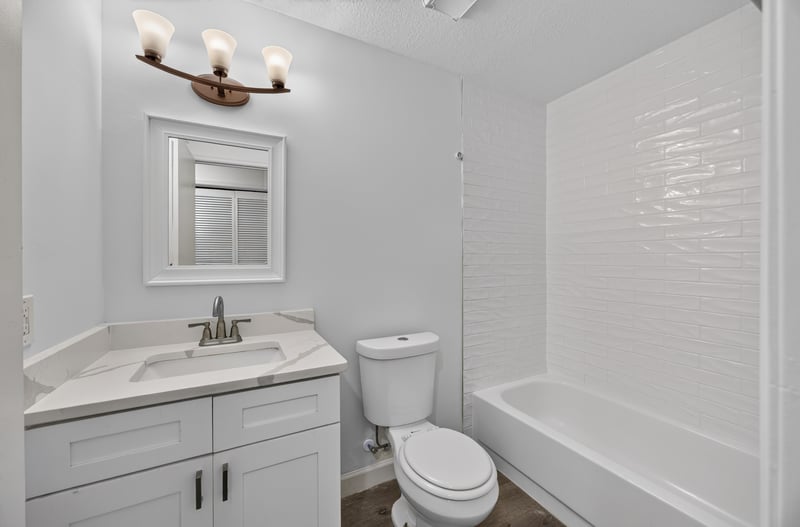 Bathroom with vanity, toilet and tub at 551 Deltona Blvd, St. Augustine, FL 32086