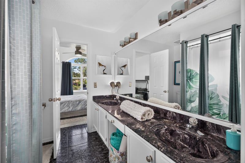 Bathroom with long vanity and mirrors at 1346 Gately Ct, Jacksonville, FL 32225
