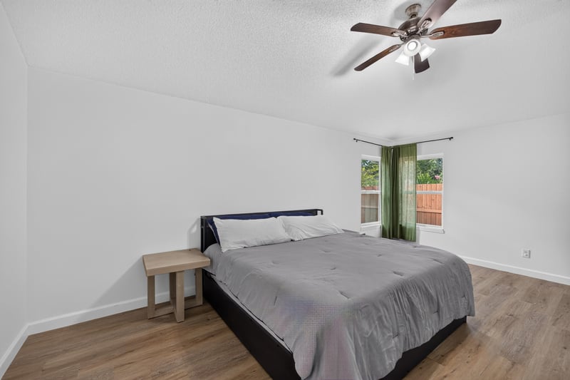 Bedroom with bed and ceiling fan at 8921 Needlepoint Pl, Jacksonville, FL 32244