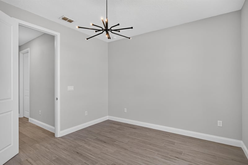 Bedroom with a modern light fixture at 91 Tilloo Ct, St. Johns, FL