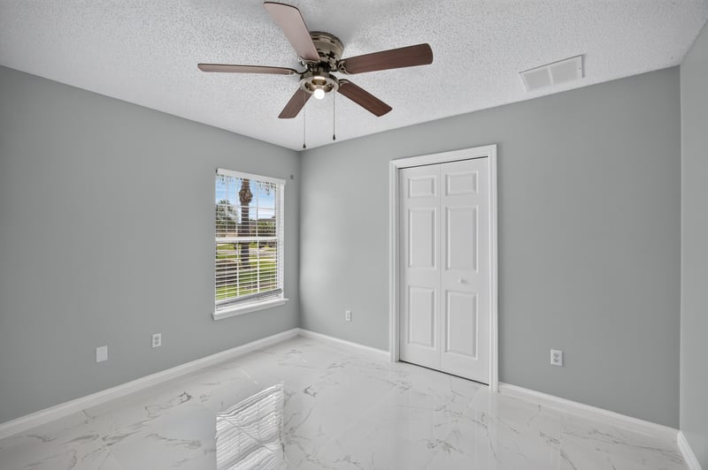 Bedroom with window and ceiling fan at 490 Hillside Dr, Orange Park, FL 32073