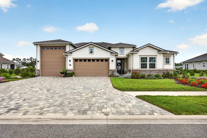 Front exterior in daylight with paver driveway at 85491 Fall River Pkwy, Fernandina Beach, FL 32034