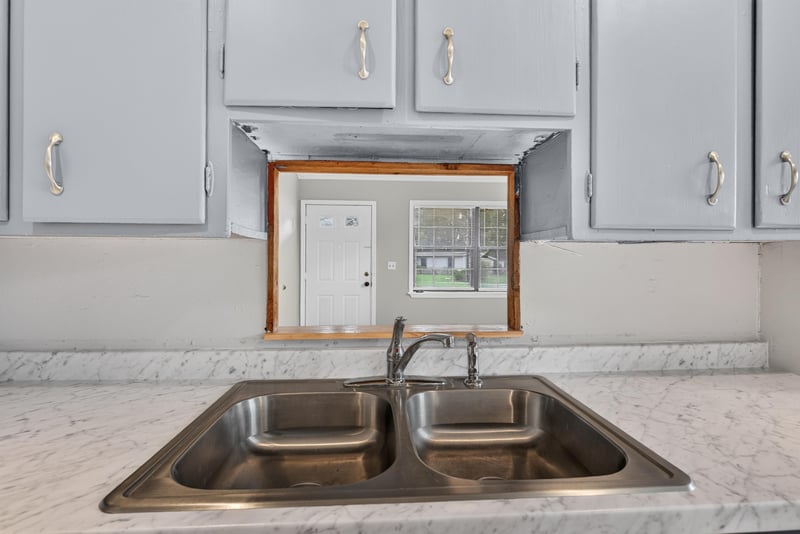 Kitchen sink close-up with stainless double basin at 255 Woodside Dr, Orange Park, FL 32073
