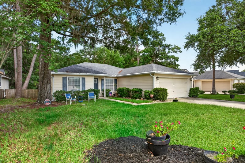 Front exterior view across the street at 145 Dover Bluff Dr, Orange Park, FL