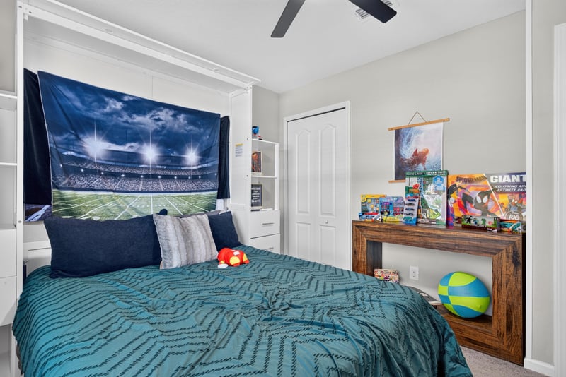 Secondary bedroom with sports-themed decor at 589 Seville Pkwy, St. Augustine, FL