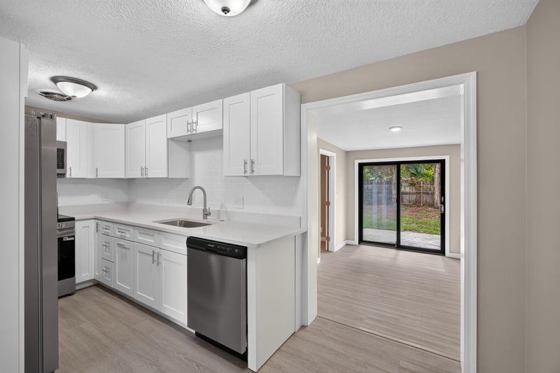 Kitchen with white cabinets and stainless appliances at 184 Draco St, Orange Park, FL 32073