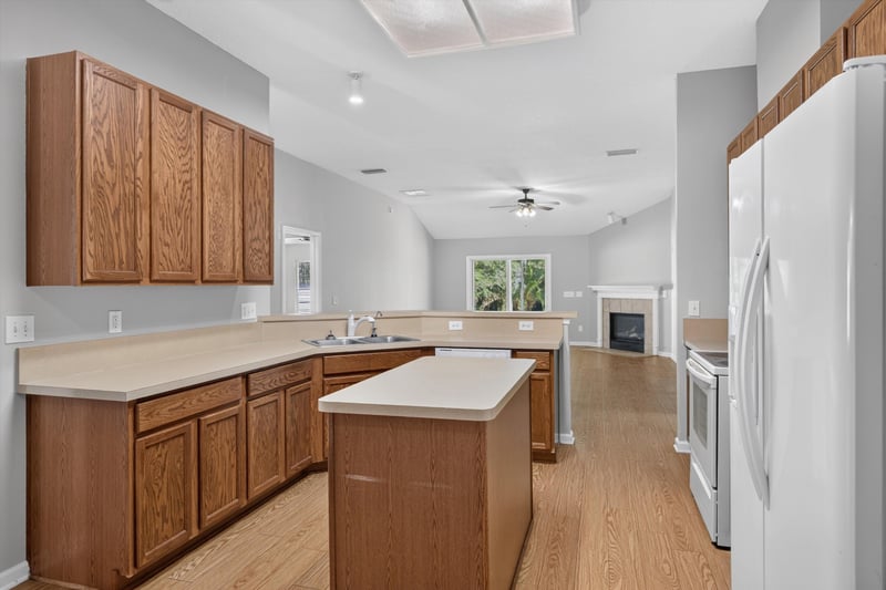 Kitchen with island and fireplace in view at 14147 Fish Eagle Dr E, Jacksonville, FL 32226