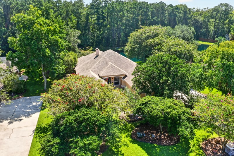 Aerial of the home close among the trees at 11675 Magnolia Estates Rd, Jacksonville, FL 32223