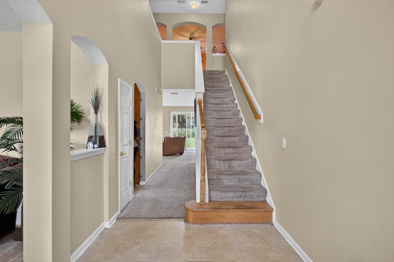 Entry hallway with staircase at 2875 Pebblewood Ln, Orange Park, FL 32065