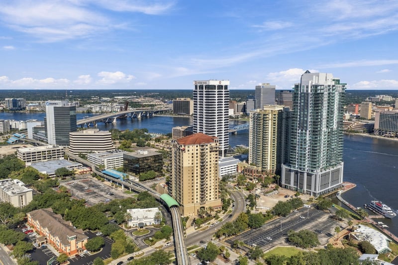 Day aerial of downtown Jacksonville high-rises and riverfront in Jacksonville, FL