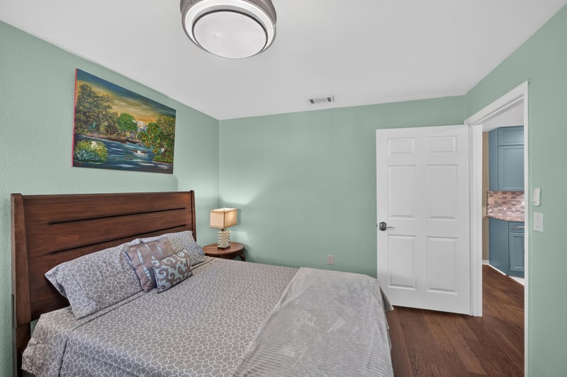 Bedroom with bed and closet doors at 10150 Belle Rive Blvd, Jacksonville, FL