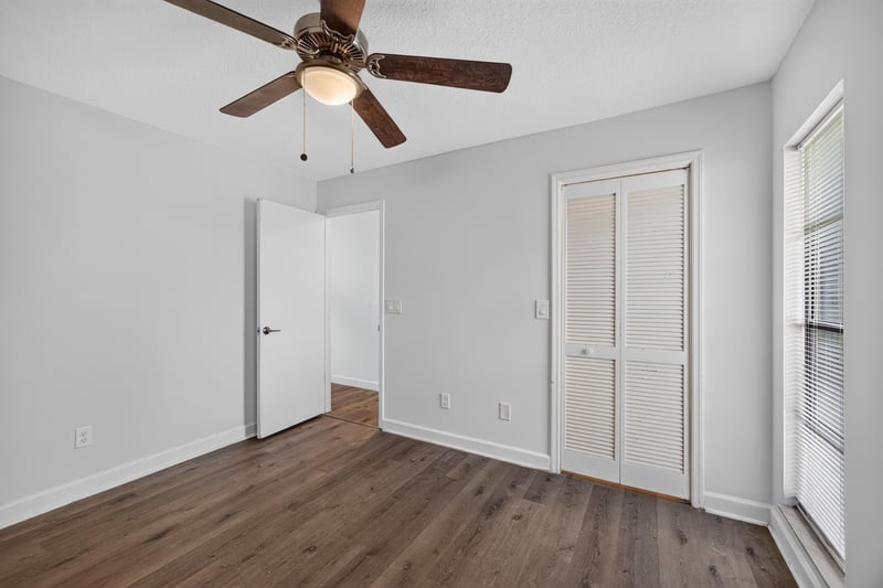 Room with wood floor and two doors at 551 Deltona Blvd, St. Augustine, FL 32086