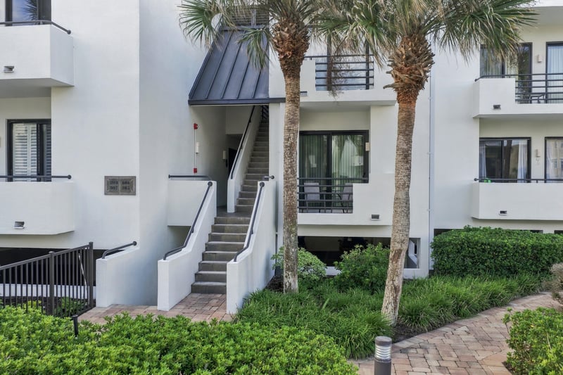 Building exterior with palm trees at 805 Spinnakers Reach Dr, Ponte Vedra Beach, FL 32082