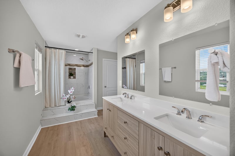 Primary bathroom with dual vanity and soaking tub at 6830 Hanford St, Jacksonville, FL 32219