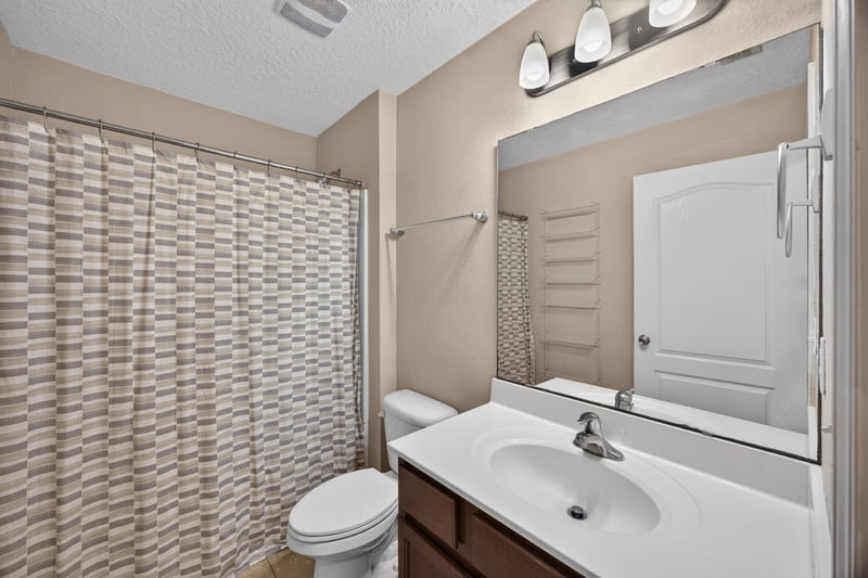 Bathroom with tub-shower combo and vanity at 469 Glendale Ln, Orange Park, FL