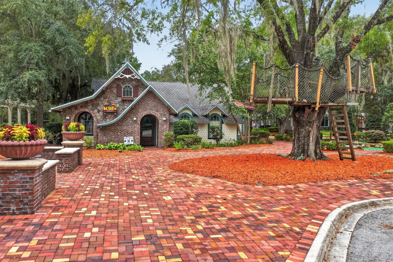 Community clubhouse with treehouse play structure in Oakleaf Plantation