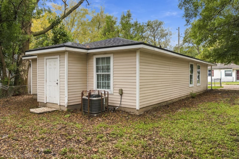 Side yard view with steps and AC unit at 219 Shortreed St, Jacksonville, FL 32254