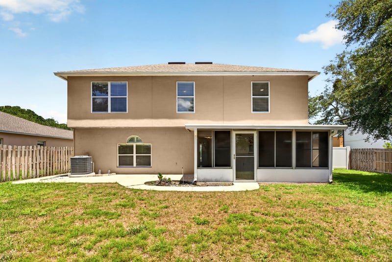 Back exterior with screened porch and lawn at 3428 Glenn Hollow Ct, Jacksonville, FL 32226