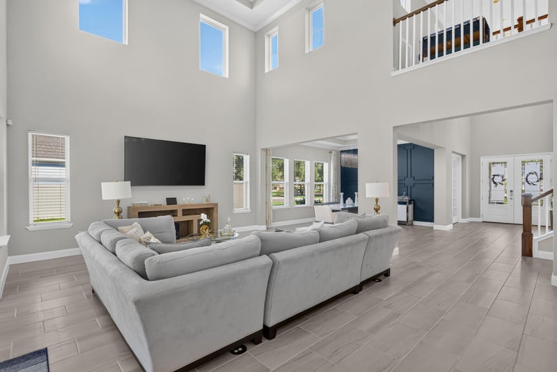 Living room view with two-story ceiling at 22 Azura Point