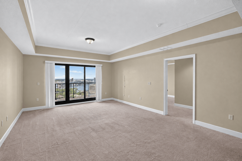 Living room with carpet and city-facing window at 1478 Riverplace Blvd 1904, Jacksonville, FL 32207