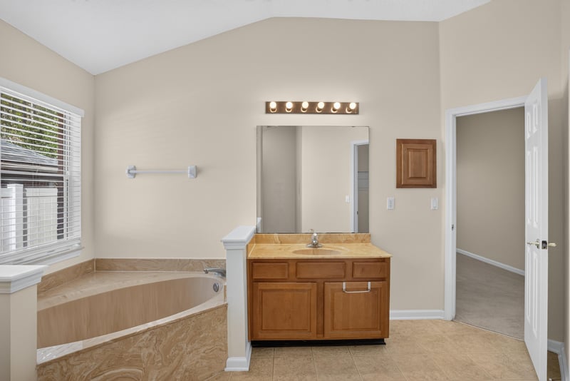 Primary bathroom with dual sinks and tub at 299 John's Creek Pkwy, St. Augustine, FL 32092
