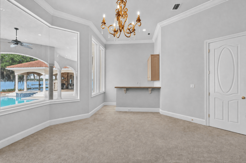 Empty bonus room with arched mirror wall at 344 Broward Rd, Jacksonville, FL