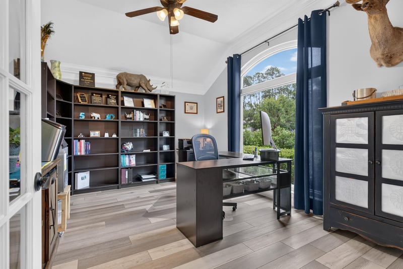 Home office with built-in shelving at 2304 Spring Hill Ct, Orange Park, FL