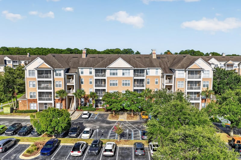 Aerial view of the condo building rooftop and parking area at 11251 Campfield Dr unit 1202, Jacksonville, FL 32256