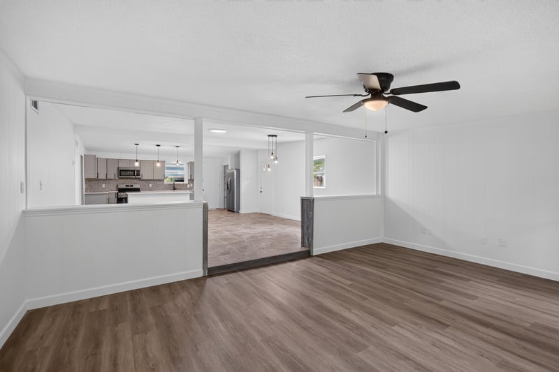 Living area with wood-look flooring and ceiling fan at 3113 Kline Rd, Jacksonville, FL 32246