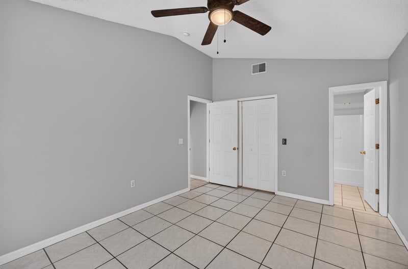 Bedroom with tile floor and ceiling fan at 7329 Lawn Tennis Ln, Jacksonville, FL