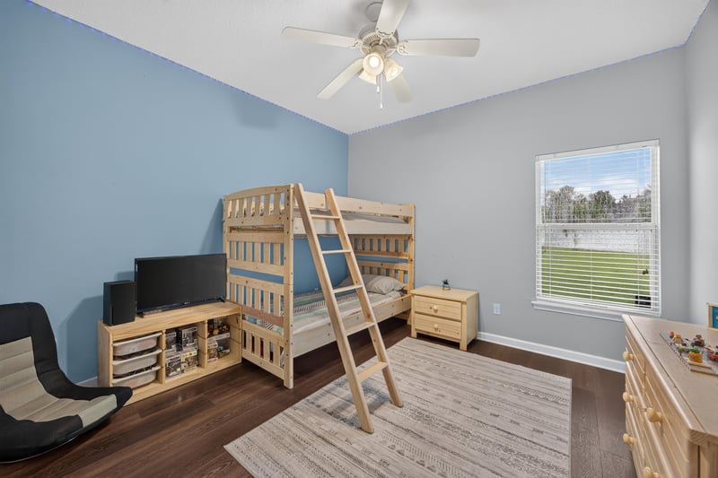 Bedroom with bunk bed and teal wall at 538 Porta Rosa Circle, St. Augustine, FL 32092