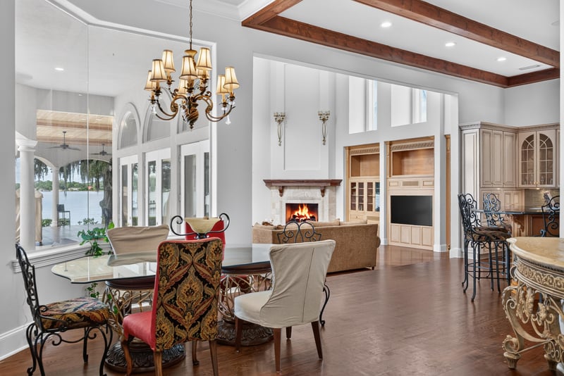 Dining area off the kitchen with fireplace and lake view at 344 Broward Rd, Jacksonville, FL