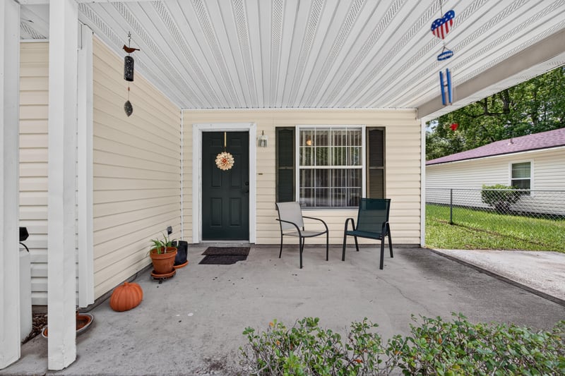 Covered front porch with seating at 5375 Dodge Rd, Jacksonville, FL 32209