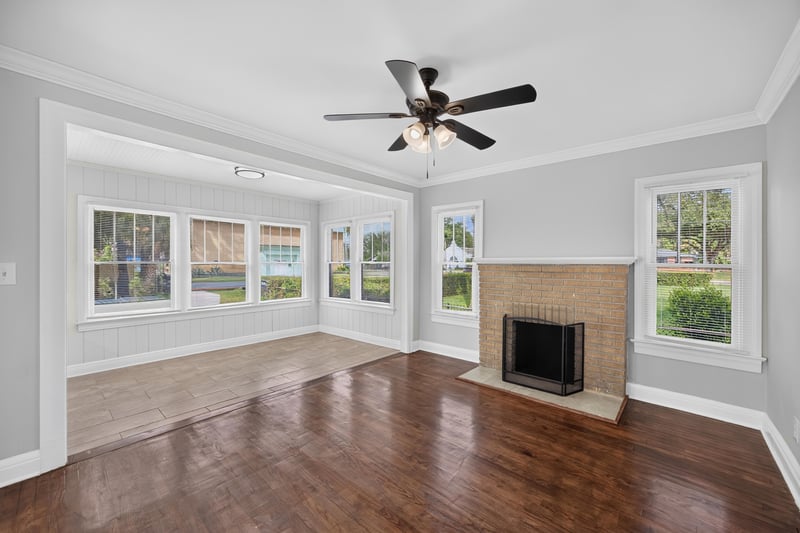 Living room with brick fireplace and hardwood floors at 316 W 41st St, Jacksonville, FL 32206