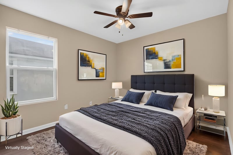 Primary bedroom virtually staged with bed and nightstands at 7253 Townsend Village Ct, Jacksonville, FL