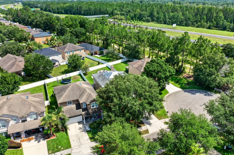 Aerial view of the subdivision streets and rooftops in Orange Park, FL