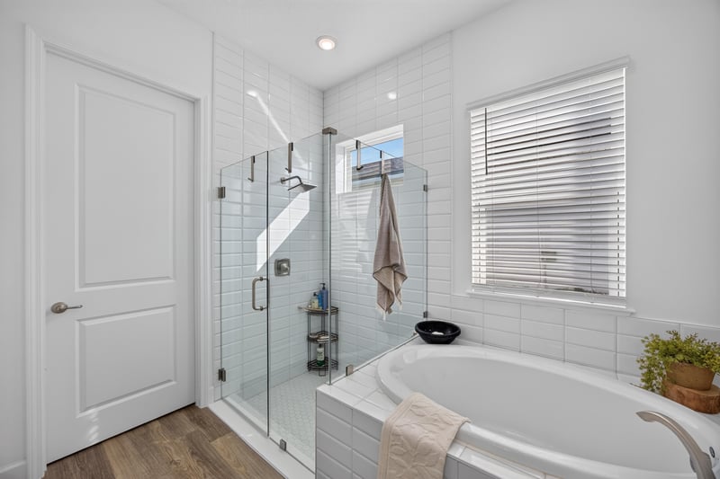 Primary bathroom with glass shower and soaking tub at 129 Amberwood Dr, St. Augustine, FL