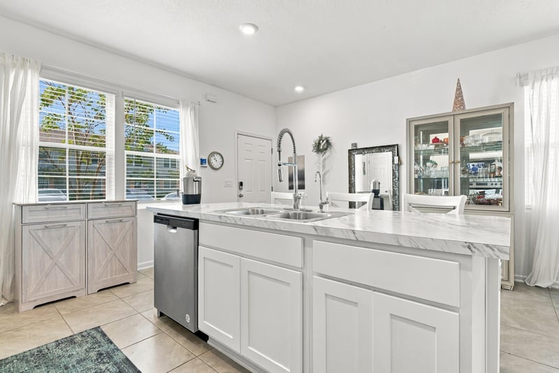 Kitchen sink area with window and dishwasher at 8359 Zenith Cir, Jacksonville, FL 32256