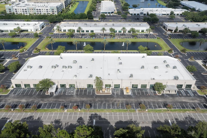 Aerial view of a roofline with ponds and parking lots at 10550 Deerwood Park Blvd, Jacksonville, FL 32256