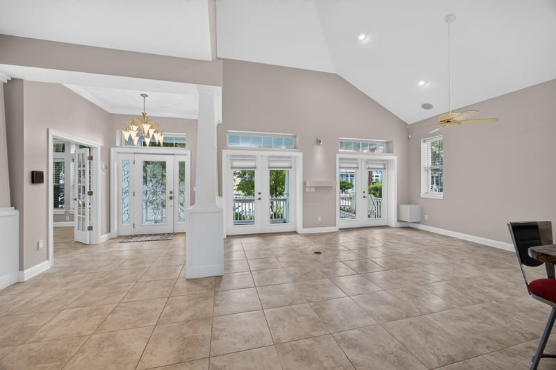 Living room with french doors at 117 Island Cottage Way, St. Augustine, FL 32080