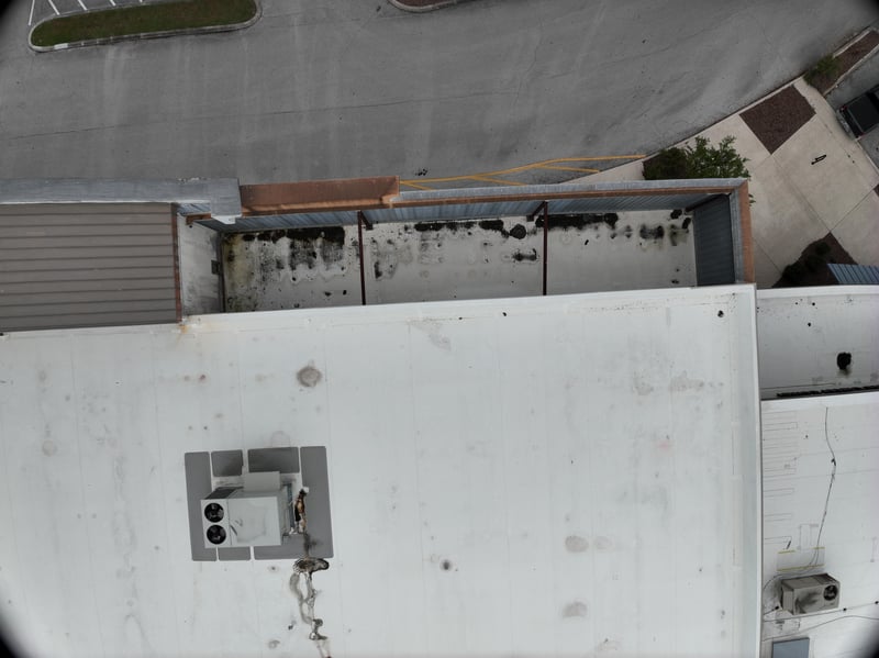 Aerial view of rooftop edge and parking lot below at 9406 Atlantic Blvd, Jacksonville, FL 32225